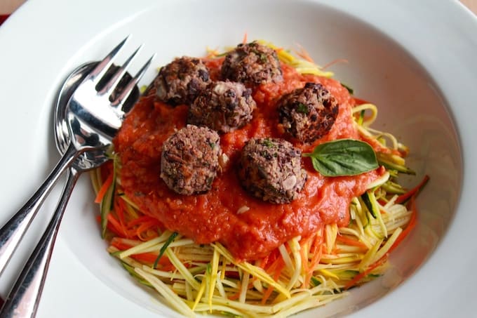 Veggie Spaghetti and Meatballs | Destination Delish - A meatless take on the classic pasta dish with veggie noodles, a homemade tomato sauce, and black bean meatballs. Gluten-free. Vegan.