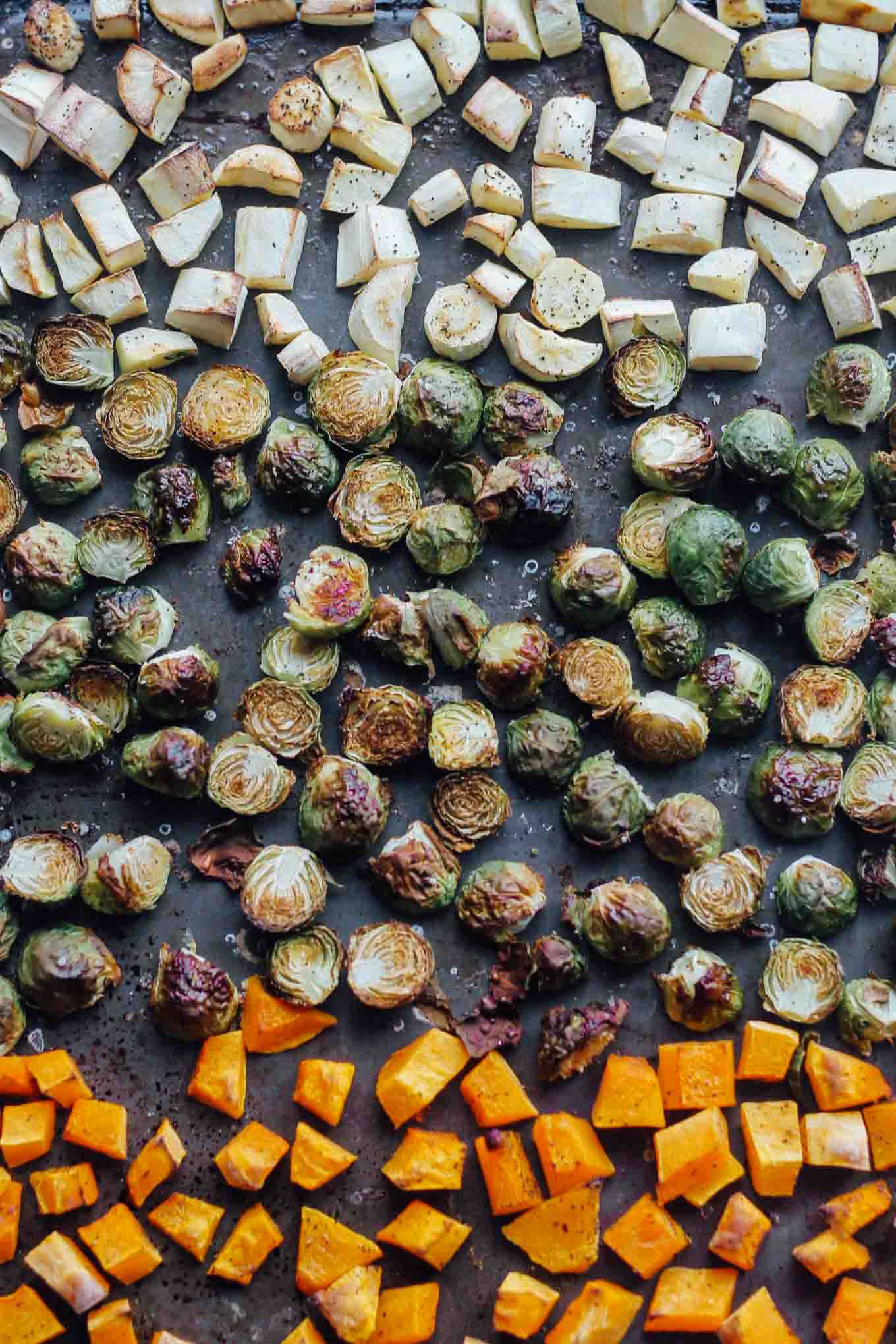 Roasted parsnips, Brussels sprouts, and butternut squash on a sheet pan