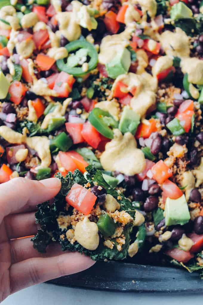 Loaded Kale Nachos | Destination Delish - Kale chips, cauliflower taco meat, and cashew nacho cheese make up the healthiest, most indulgent nachos you will ever eat!