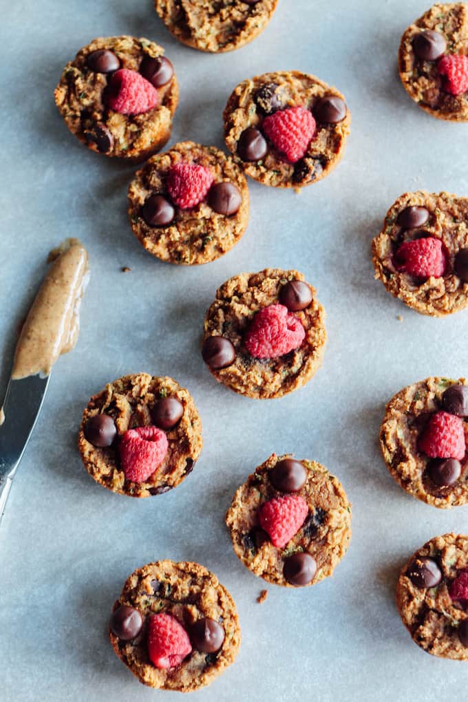  Chocolate Raspberry Zucchini Muffins | Destination Delish - soft and gooey muffins topped with chocolate and raspberries. Made luscious with almond butter and coconut flour. gluten-free, grain-free, dairy-free, and egg free
