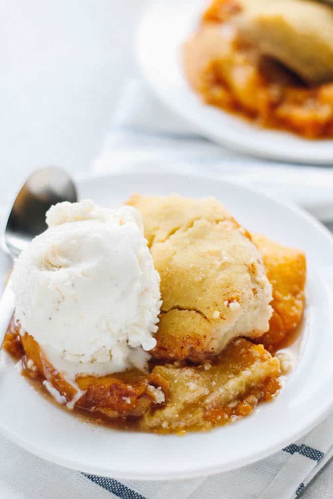 Coconut Peach Cobbler | Destination Delish - A gluten-free, paleo version of the classic peach cobbler yielding a cake-like texture with a warm peach compote.