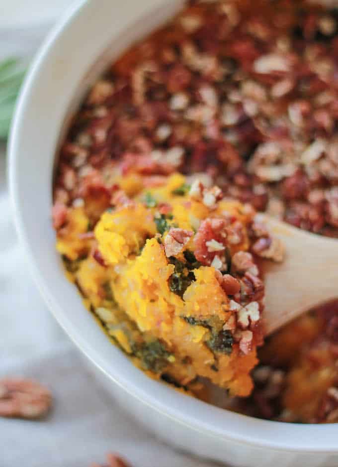 Butternut Squash, Bacon, and Kale Casserole | Destination Delish - a sweet and savory Thanksgiving side dish filled with kale and topped with crunchy pecans and bacon