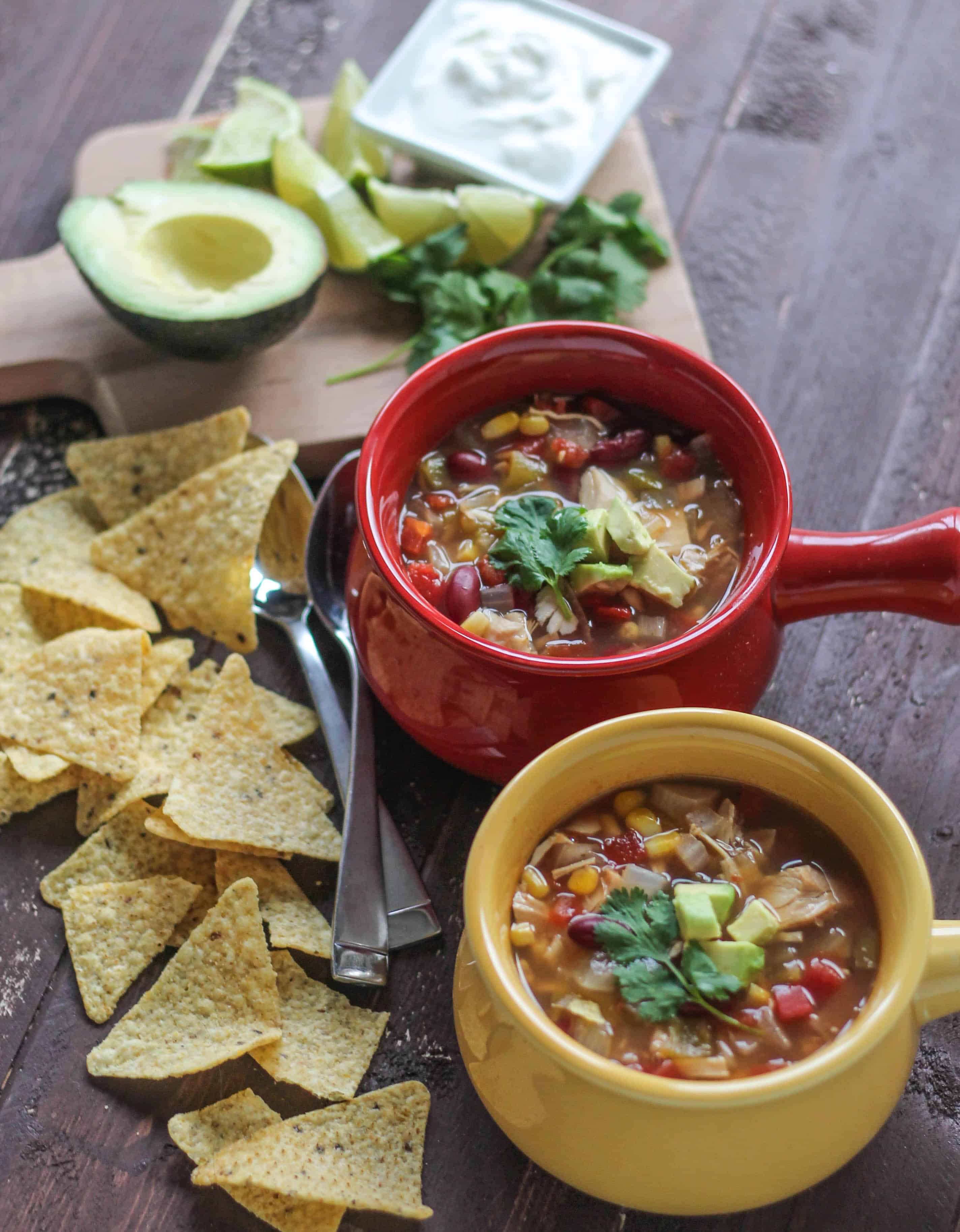 Turkey Taco Soup | Destination Delish - A quick and easy recipe for a hearty, southwest-spiced soup with turkey, beans, corn, and tomatoes and all your favorite toppings