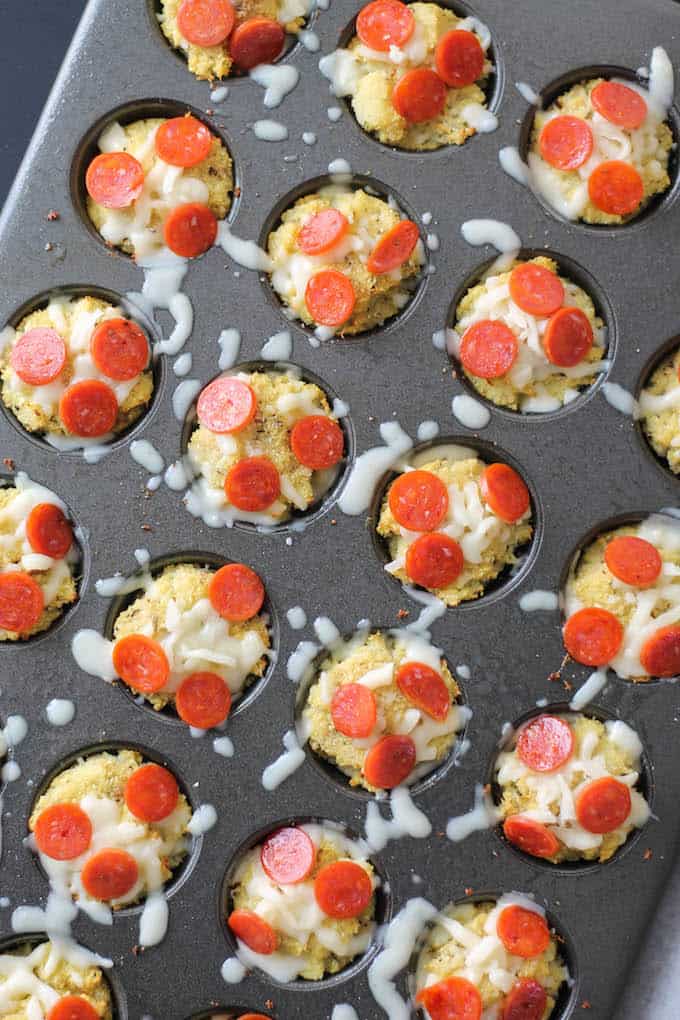 Cauliflower Pizza Bites | Destination Delish - Cauliflower crust pizza made into mini bites with a cheesy surprise in the middle