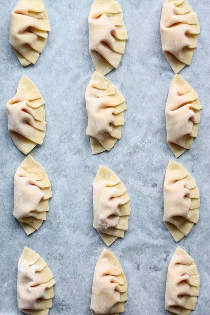 Kimchi Pineapple Dumplings | Destination Delish - A unique take on the traditional Chinese dumpling. This sweet and spicy appetizer is filled with ground turkey, pineapple, and kimchi