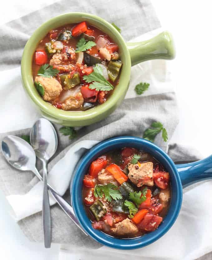 Poblano, Pork, and Quinoa Chili | Destination Delish – an eclectic chili filled with tender pork, fire roasted tomatoes, peppers, and quinoa simmered in a orange-cinnamon infused broth