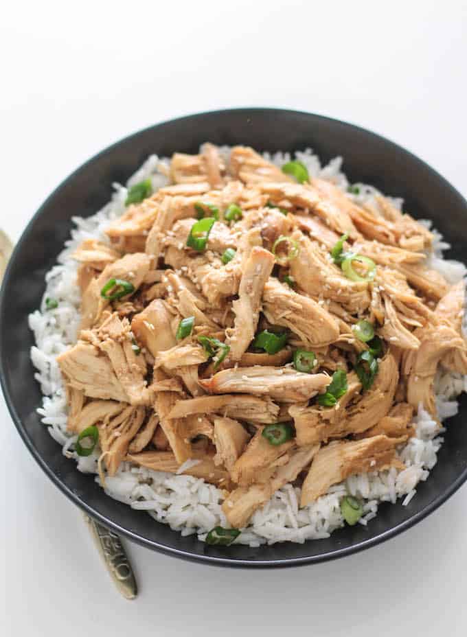 Slow Cooker Korean Pulled Chicken | Destination Delish – an easy recipe for tender chicken cooked in a sweet and savory mixture of garlic, ginger, and soy sauce