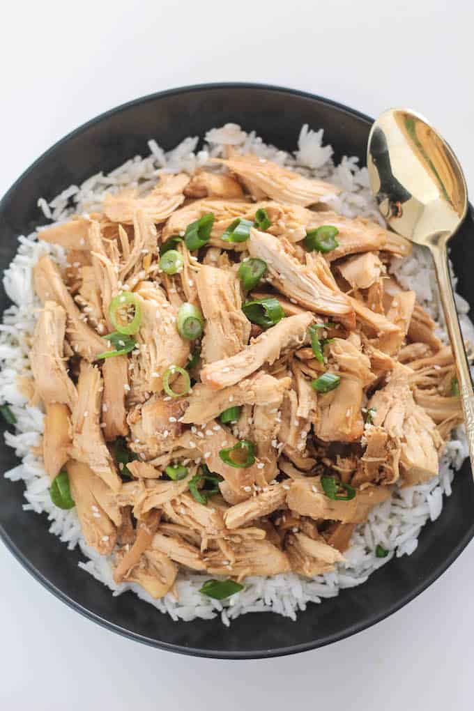 Slow Cooker Korean Pulled Chicken | Destination Delish – an easy recipe for tender chicken cooked in a sweet and savory mixture of garlic, ginger, and soy sauce
