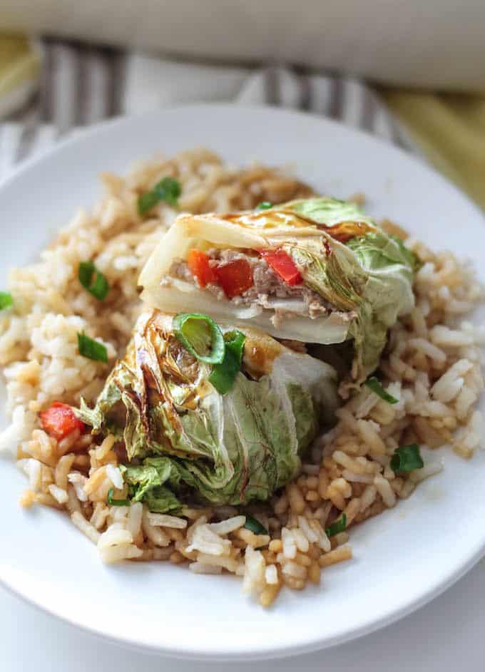 Teriyaki Turkey Cabbage Rolls - A quick and easy Asian-inspired recipe. These healthy cabbage rolls are stuffed with sweet pineapple, chopped veggies, and ground turkey. It’s a wholesome meal perfect for busy weeknights! 