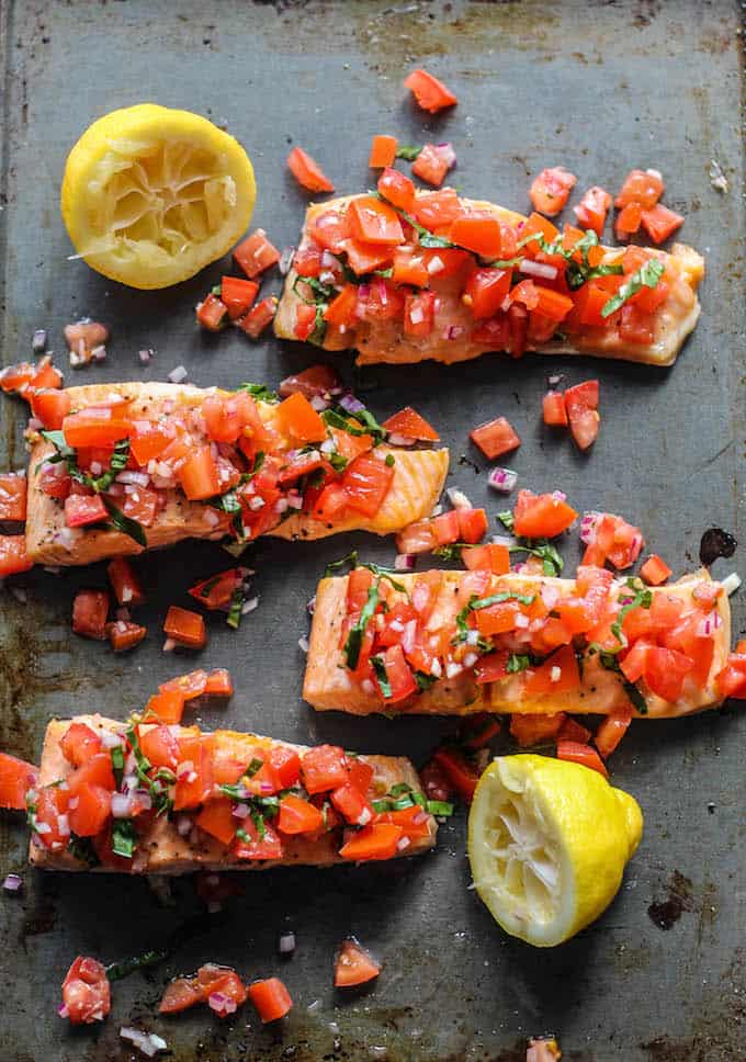 Roasted Salmon with Tomato Basil Relish | Destination Delish – a quick and easy recipe for roasted salmon topped with a vibrant, tangy, and fresh Italian-inspired relish