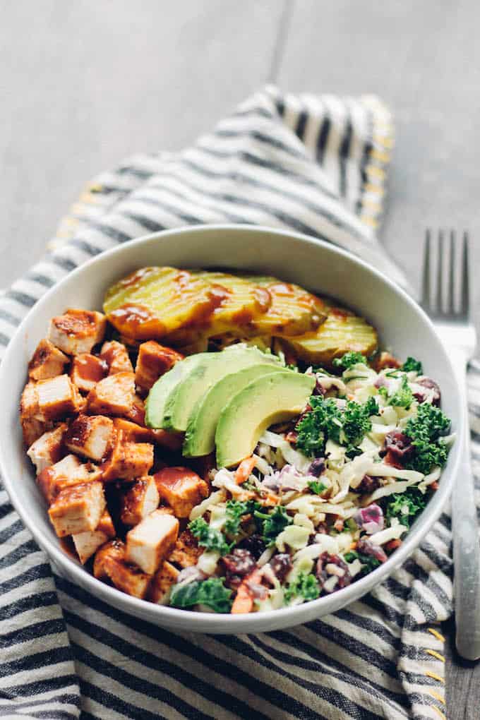 BBQ Chicken Coleslaw Bowls | Destination Delish – a healthy bowl full of tender chicken and coleslaw topped with pickles and creamy avocado slices! It’s everything you love about summer barbecues in a bowl!
