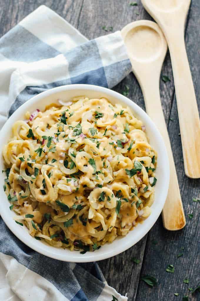 Spiralized Dijon Potato Salad | Destination Delish – a quick and easy side dish made with potato noodles and a simple Dijon vinaigrette dressing. This salad is sure to be a hit at any summer picnic! Gluten-free.