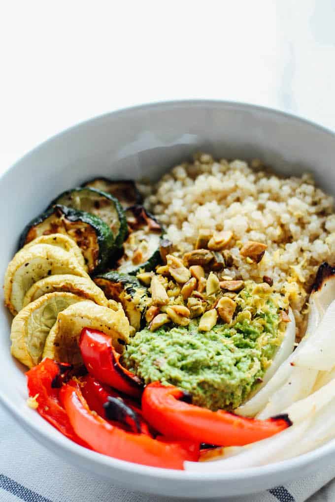 Quinoa Bowls with Pea Pesto | Destination Delish – wholesome vegetarian bowls full of quinoa and roasted veggies topped with a zesty and sweet pea pesto