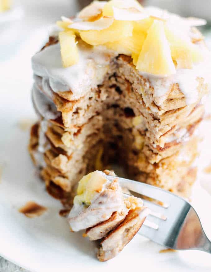 Piña Colada Pancakes | Destination Delish - Paleo pancakes with a tropical flair, using wholesome ingredients like coconut flour, nut butter, and fresh pineapple.