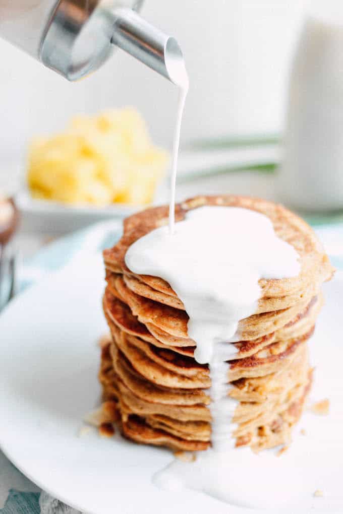 Piña Colada Pancakes | Destination Delish - Paleo pancakes with a tropical flair, using wholesome ingredients like coconut flour, nut butter, and fresh pineapple.