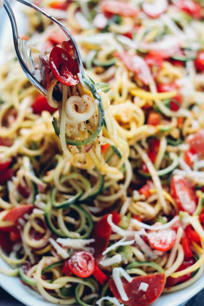 Spiralized Spaghetti Salad | Destination Delish – a zesty summer potluck favorite made healthy with zucchini noodles, turkey pepperoni, and plenty of chopped veggies. 