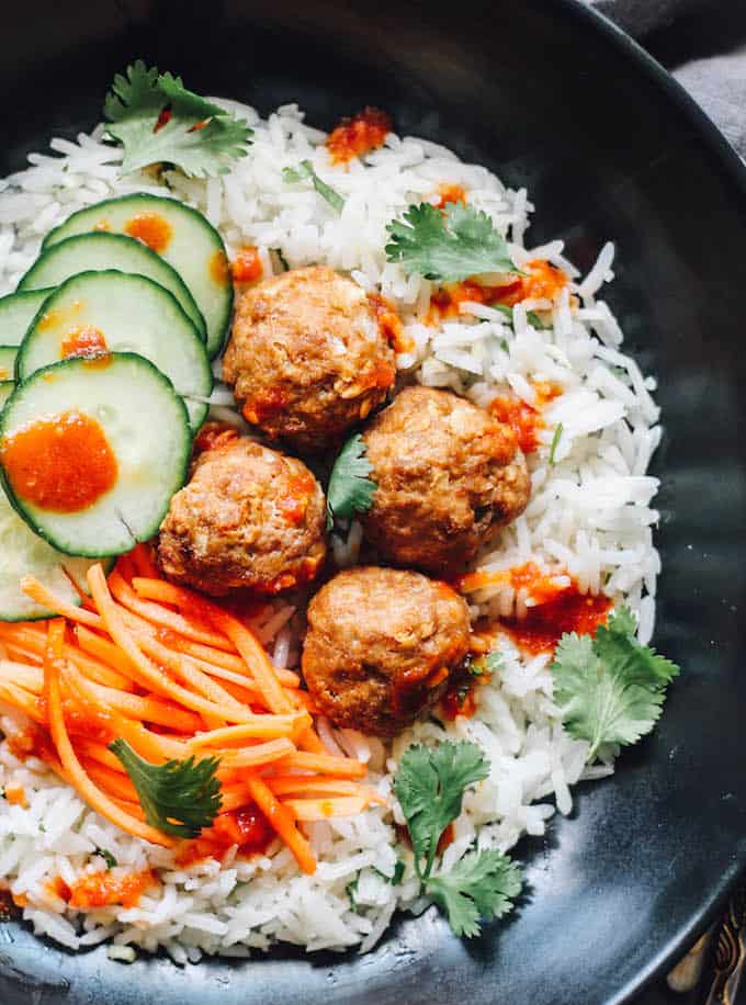Thai Turkey Meatballs over Ginger Coconut Basmati Rice | Destination Delish – Red curry-spiced meatballs with chili garlic sauce served over authentic basmati rice simmered in coconut milk and infused with fresh ginger