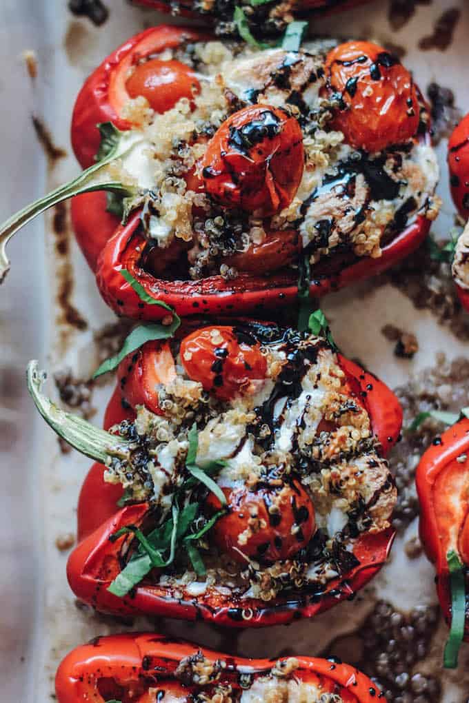 Quinoa Caprese Stuffed Peppers | Destination Delish – The classic caprese cooked inside a bell pepper! It’s a light and fresh summer side dish easy enough for weeknights and fancy enough for guests! 