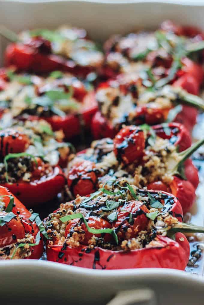 Quinoa Caprese Stuffed Peppers | Destination Delish – The classic caprese cooked inside a bell pepper! It’s a light and fresh summer side dish easy enough for weeknights and fancy enough for guests! 
