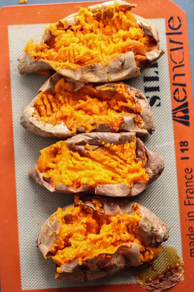 Curry Lentil Stuffed Sweet Potatoes | Destination Delish - Tangy, curry lentils tucked inside a tender sweet potato. It’s a healthy side or main dish that’s easy to prepare and full of flavor! Vegetarian. Vegan. 