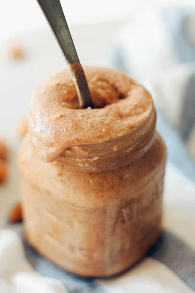 Apple Cinnamon Almond Butter | Destination Delish - homemade almond butter with an autumn boost from dried apples and cinnamon! Your breakfast toast and oatmeal are begging for a spoonful!