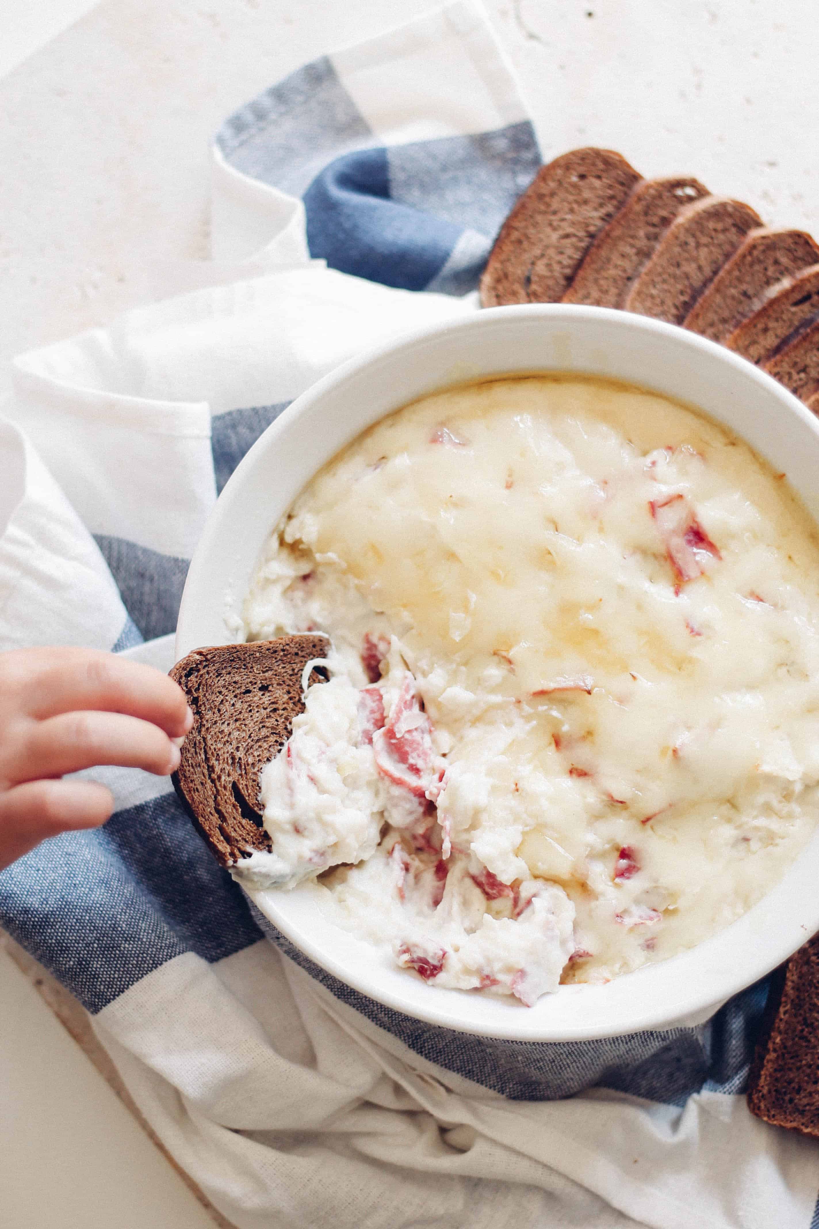 Lightened Up Reuben Dip | Destination Delish - A rich and creamy reuben dip made lighter with cauliflower and light cream cheese. Enjoy with pita chips, rye bread, or veggies! 