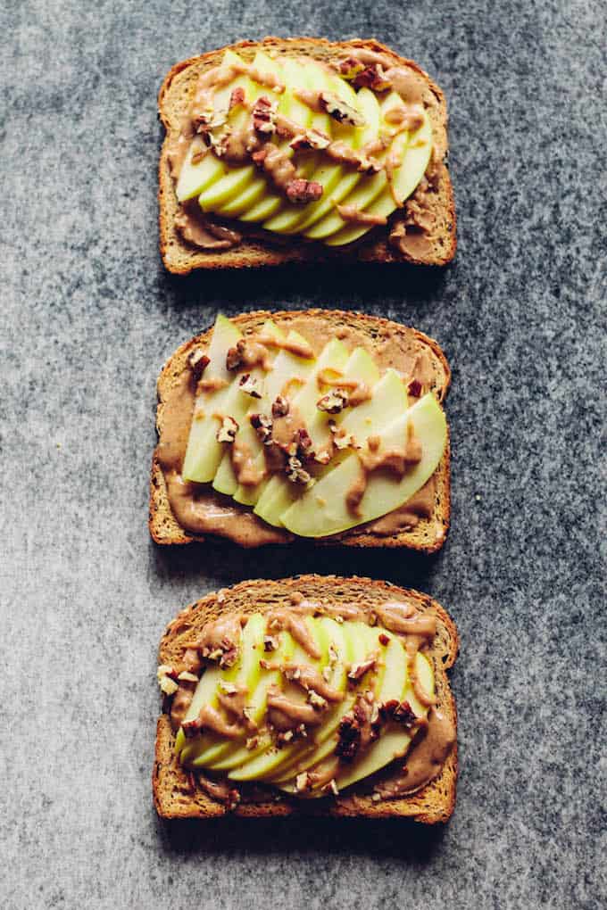 Caramel Apple Toast | Destination Delish - This wholesome, yet decadent toast is topped with almond butter, date caramel, fresh apples, and chopped nuts. 