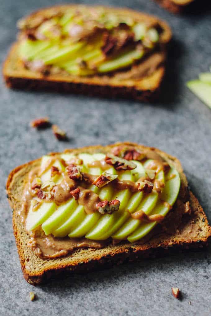 Caramel Apple Toast | Destination Delish - This wholesome, yet decadent toast is topped with almond butter, date caramel, fresh apples, and chopped nuts. 