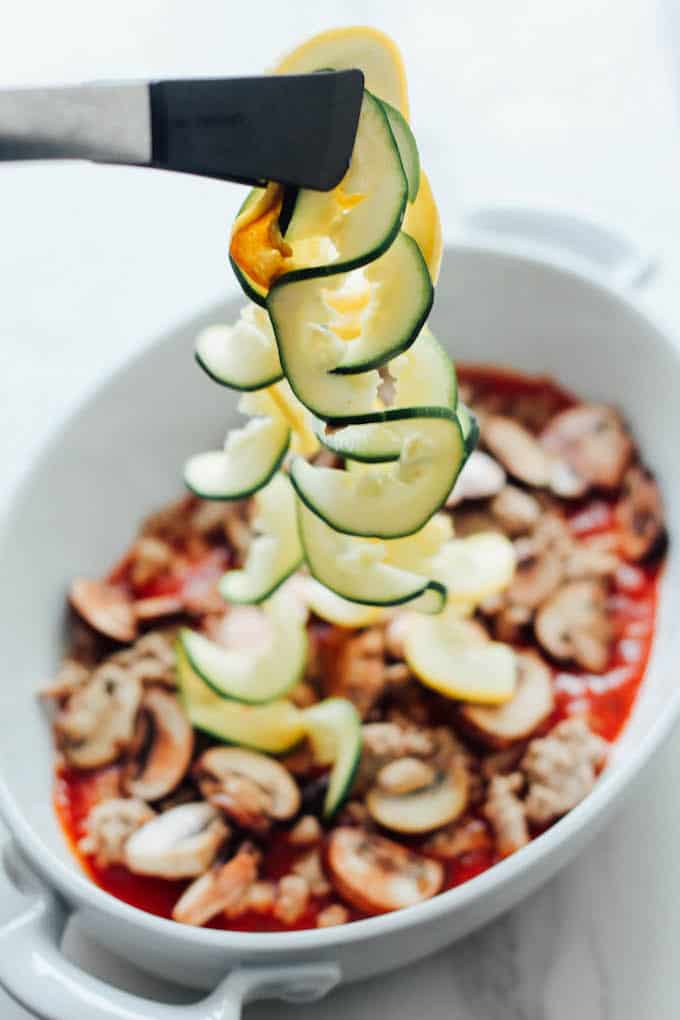 Spiralized Zucchini Lasagna Casserole | Destination Delish - Layers of zucchini noodles, ground turkey, marinara sauce and cheese. Healthy comfort food perfect for an easy weeknight dinner!