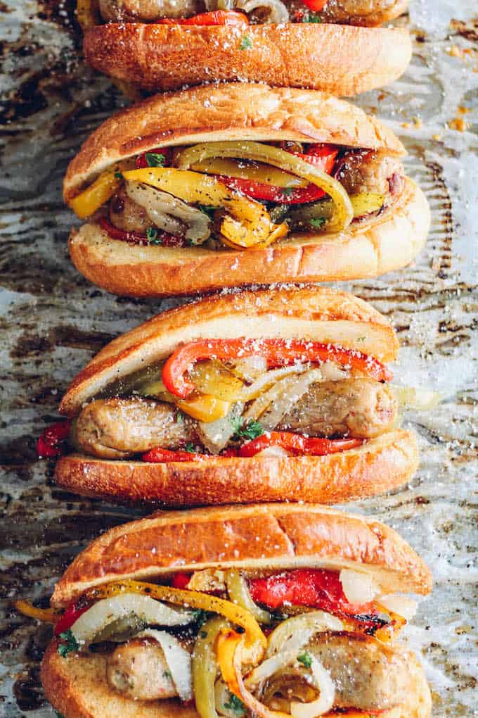Sheet Pan Sausage and Pepper Hoagies | Destination Delish - sweet peppers, caramelized onions, and chicken sausage tucked inside a toasted bun. Sheet pan dinner perfection!