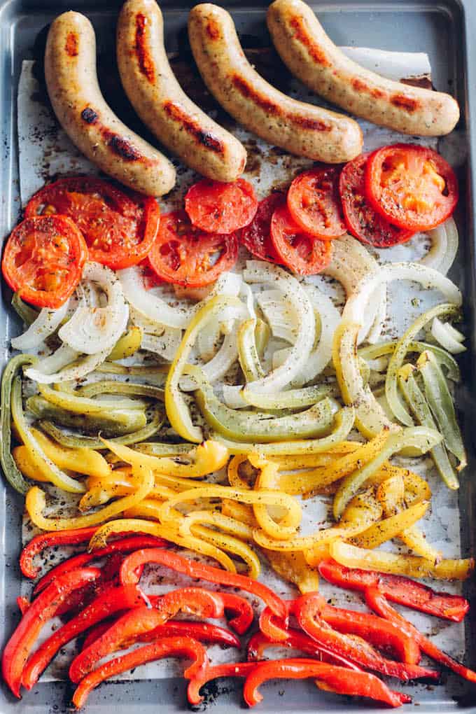 Sheet Pan Sausage and Pepper Hoagies | Destination Delish - sweet peppers, caramelized onions, and chicken sausage tucked inside a toasted bun. Sheet pan dinner perfection!