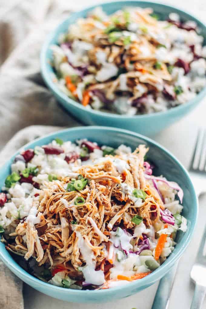  Jerk Pork Coleslaw Bowls | Destination Delish - Spice up your dinner routine with the flavors of Jamaica. Tender, pulled pork marinated in a spicy jerk sauce with coconut-infused rice and crisp and tangy coleslaw!