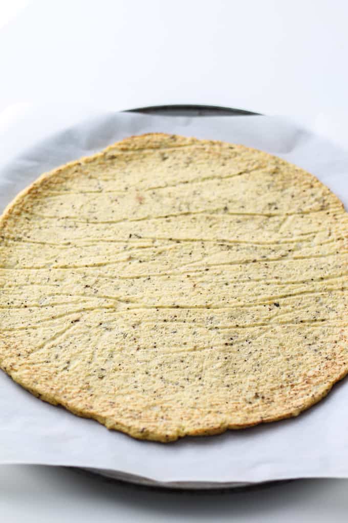 Cauliflower Pizza Crust | Destination Delish - Pile your favorite toppings on this super easy paleo Cauliflower Pizza Crust! Cauliflower, eggs, salt, and pepper are all you need to make this healthy and tasty pizza crust!