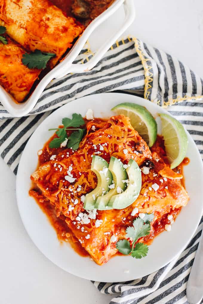 These breakfast enchiladas use baked eggs for the tortilla! Fill them with breakfast sausage and your favorite veggies for a super tasty and unique dish!