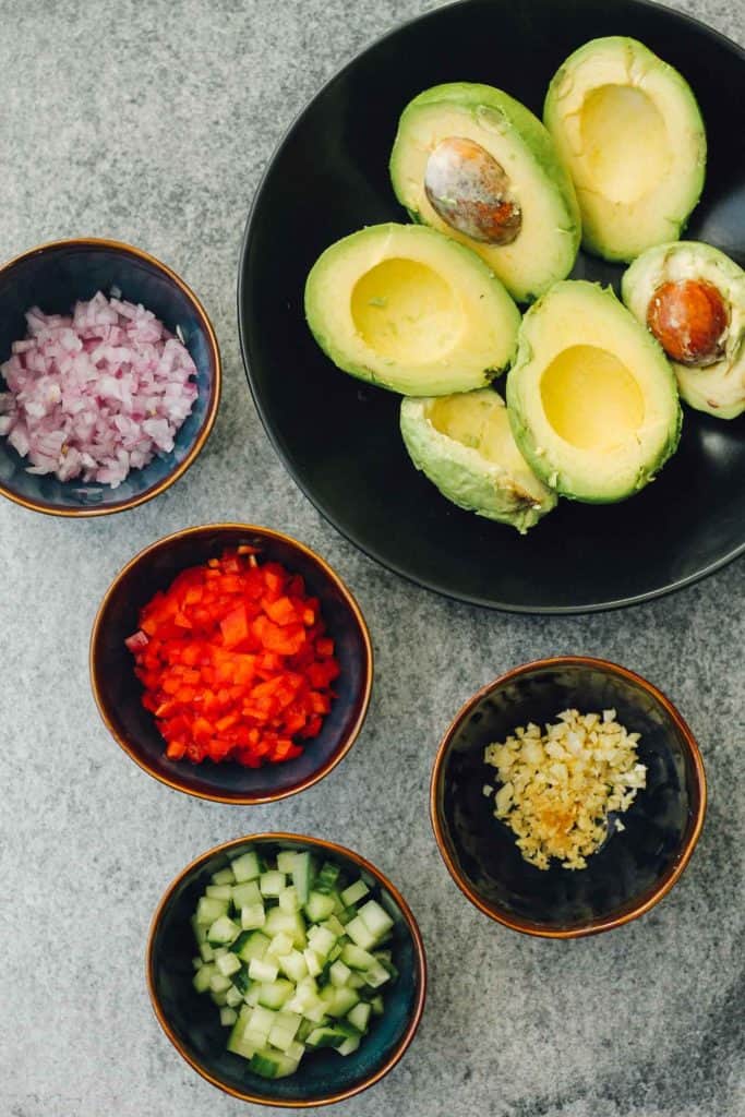 Guacamole ingredients in separate bowls