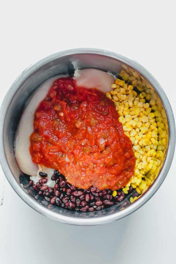 Salsa chicken ingredients in the Instant Pot before cooking