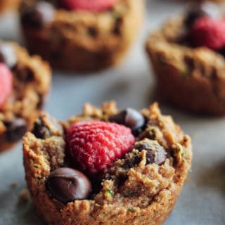 Chocolate Raspberry Zucchini Muffins | Destination Delish - soft and gooey muffins topped with chocolate and raspberries. Made luscious with almond butter and coconut flour. gluten-free, grain-free, dairy-free, and egg free
