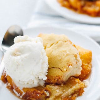 Coconut Peach Cobbler | Destination Delish - A gluten-free, paleo version of the classic peach cobbler yielding a cake-like texture with a warm peach compote.