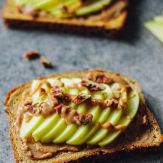 Caramel Apple Toast | Destination Delish - This wholesome, yet decadent toast is topped with almond butter, date caramel, fresh apples, and chopped nuts.