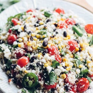 Fiesta Cauliflower Rice Salad | Destination Delish - a fluffy cauliflower rice salad packed with colorful veggies and tossed in a tangy citrus dressing. Enjoy this as a healthy side dish or light lunch!