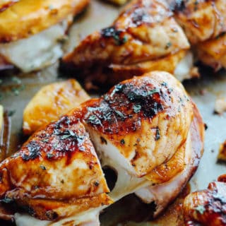 Grilled Hawaiian Stuffed Chicken | Destination Delish - chicken breasts stuffed with ham, pineapple and provolone cheese, grilled to perfection, and brushed with a pineapple teriyaki glaze. Summer grilling perfection!