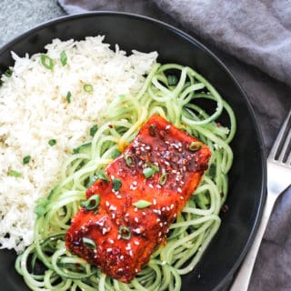 Sweet Glazed Korean Salmon over Sesame Cucumber Noodles | Destination Delish - sweet, tangy, saucy salmon served on a bed of crisp cucumber noodles. Fancy enough to serve guests and easy enough to make on a busy weeknight!