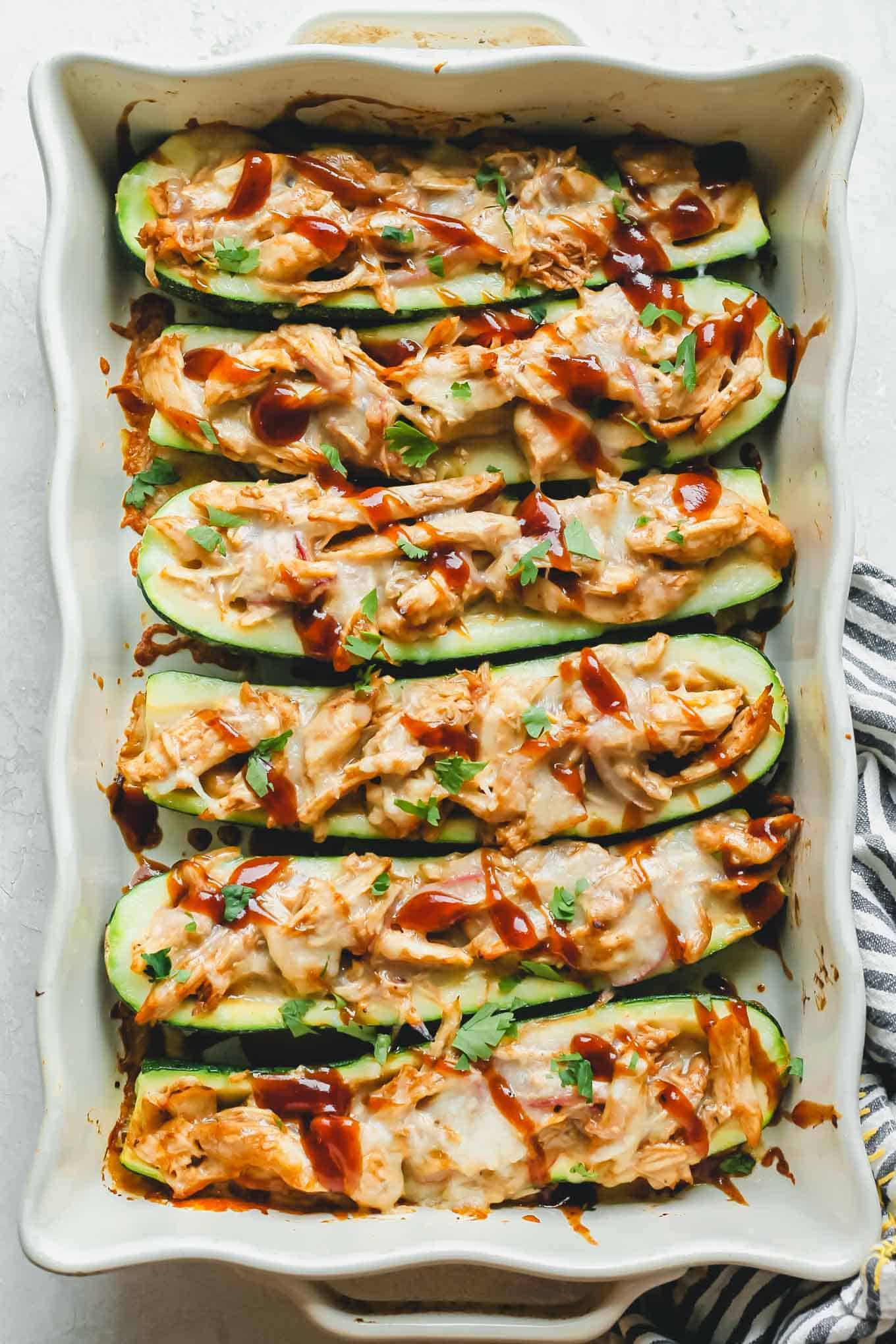 BBQ Chicken Zucchini Boats in a baking dish fresh out of the oven